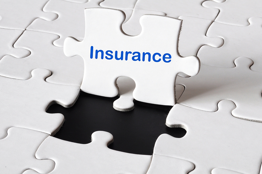 insurance concept with white puzzle or jigsaw